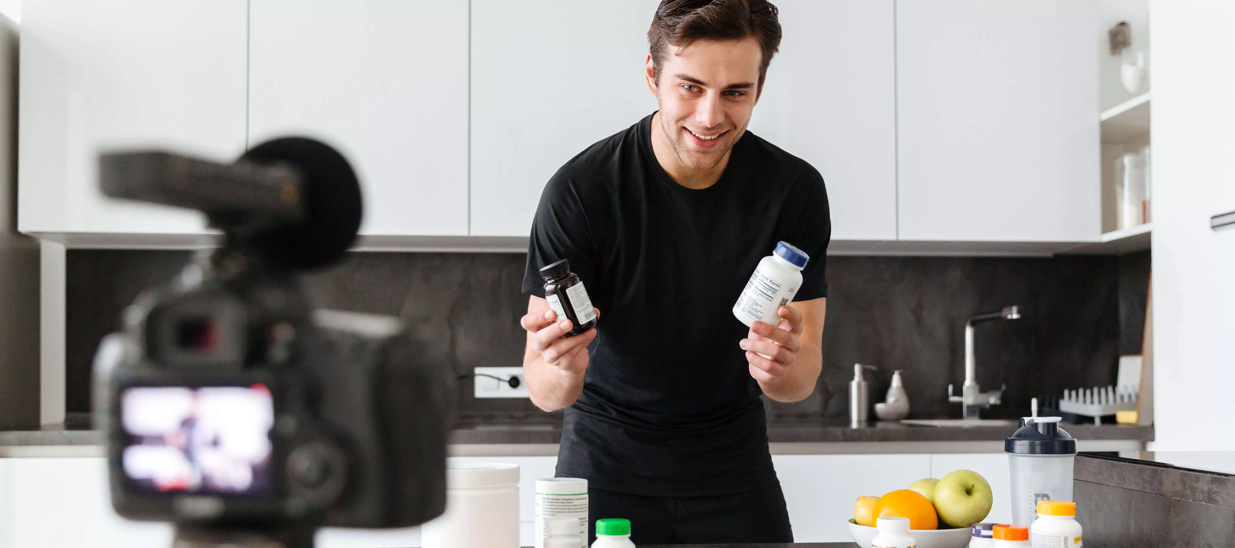 Guy showing two products during a social media promotion.