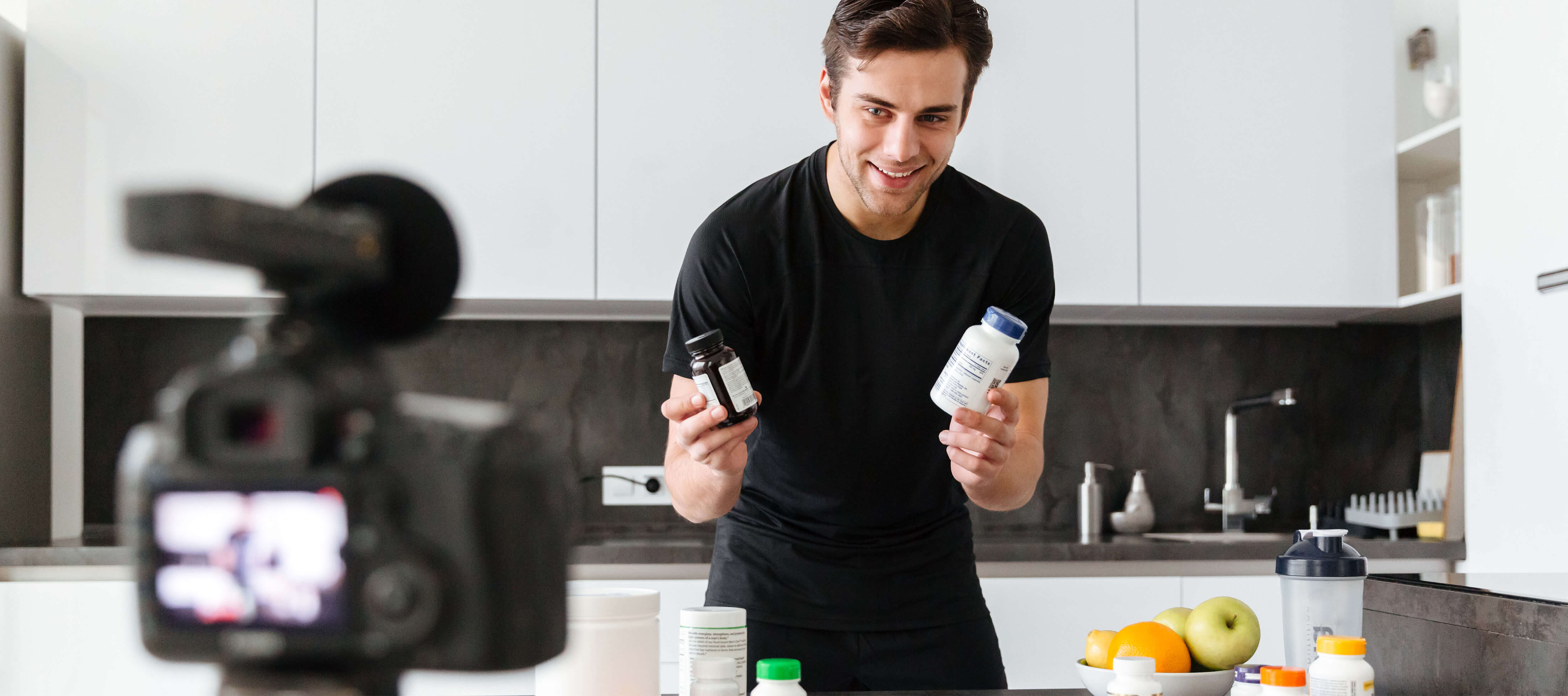 Guy showing two products during a social media promotion.